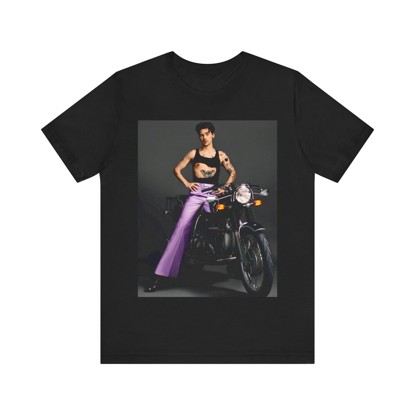 A black graphic t-shirt featuring a graphic of Harry Styles related to motorcycles or a rebellious, cool style.