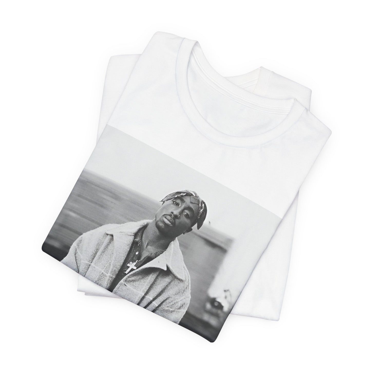 A black graphic t-shirt featuring a graphic related to Tupac's 'Thug Life' philosophy.