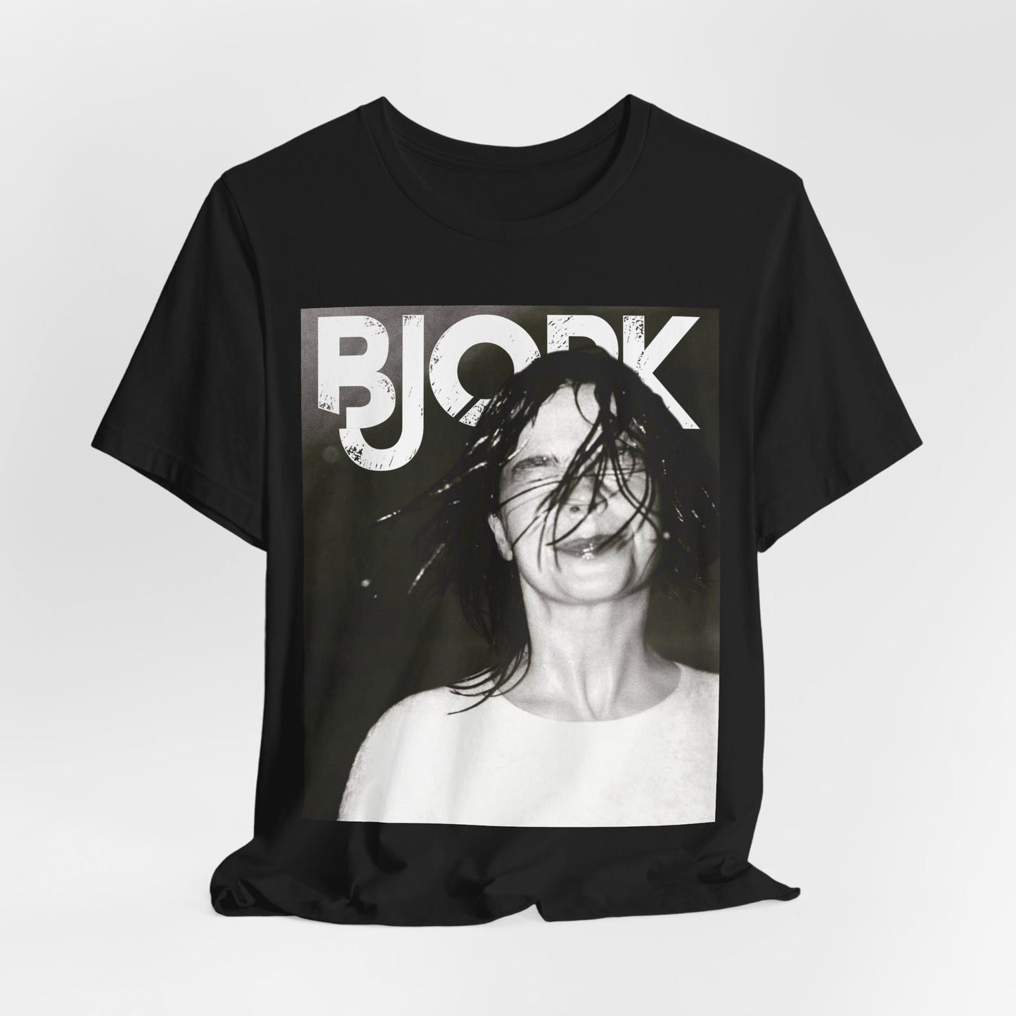 A black graphic t-shirt featuring a dark, artistic graphic of Bjork, possibly with a mysterious or otherworldly feel.