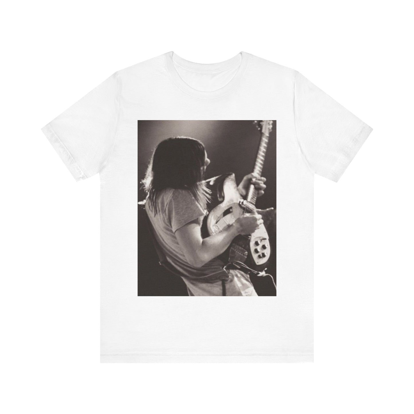 A black graphic t-shirt featuring a black and white graphic or photo of Tame Impala performing live on stage.