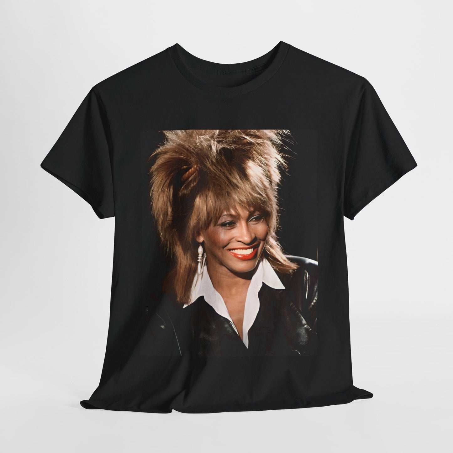 A black graphic t-shirt featuring a nostalgic graphic of Tina Turner as the Queen of Rock.