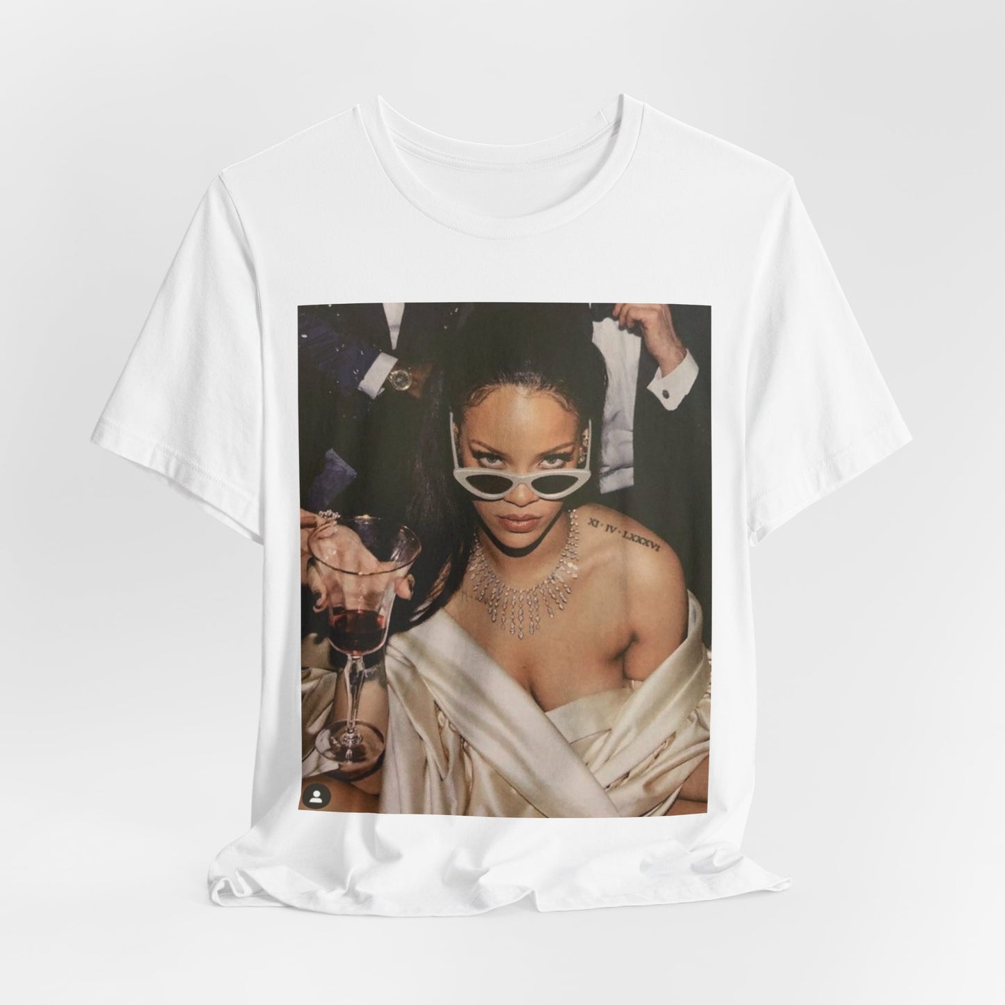 A black graphic t-shirt featuring a graphic of Rihanna as a 'Bad Gal Riri' fashion icon.