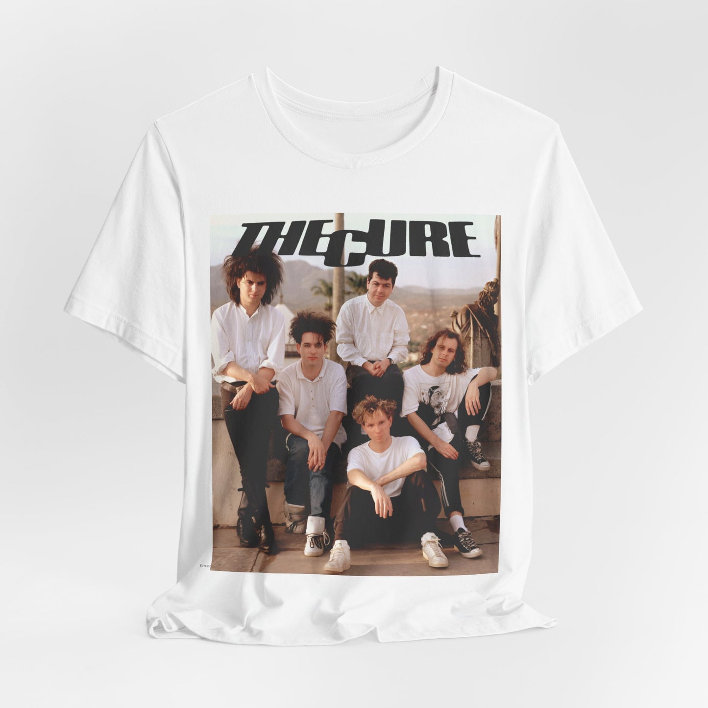 A black graphic t-shirt featuring a vintage graphic of The Cure with a dark romanticism theme.