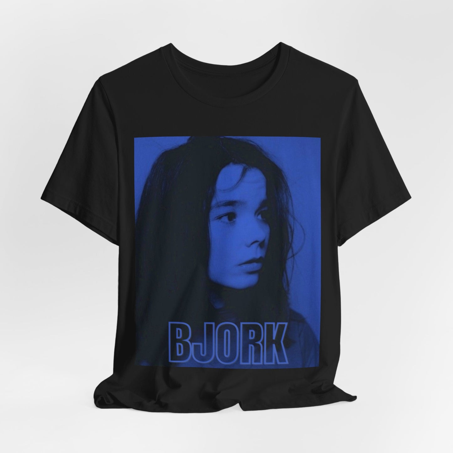 A black graphic t-shirt featuring a modern, avant-garde graphic of Bjork, possibly with abstract or futuristic elements.