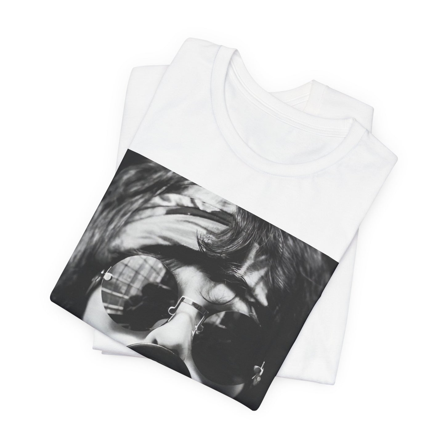 A black graphic t-shirt featuring a retro-style band photo of Aerosmith from the 1970s, showing the members in their iconic early looks.