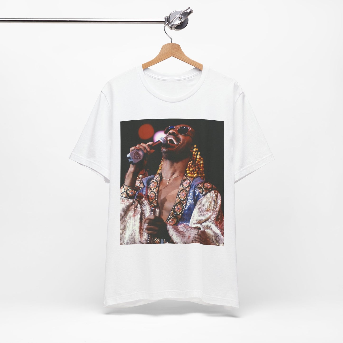 A black graphic t-shirt featuring a 70s vintage soul icon graphic of Stevie Wonder.