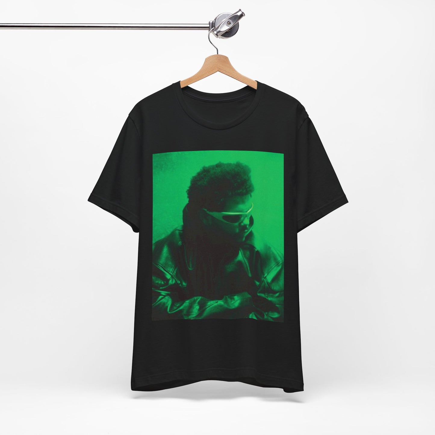 A black graphic t-shirt featuring a vintage graphic related to The Weeknd's 'Kiss Land' era.