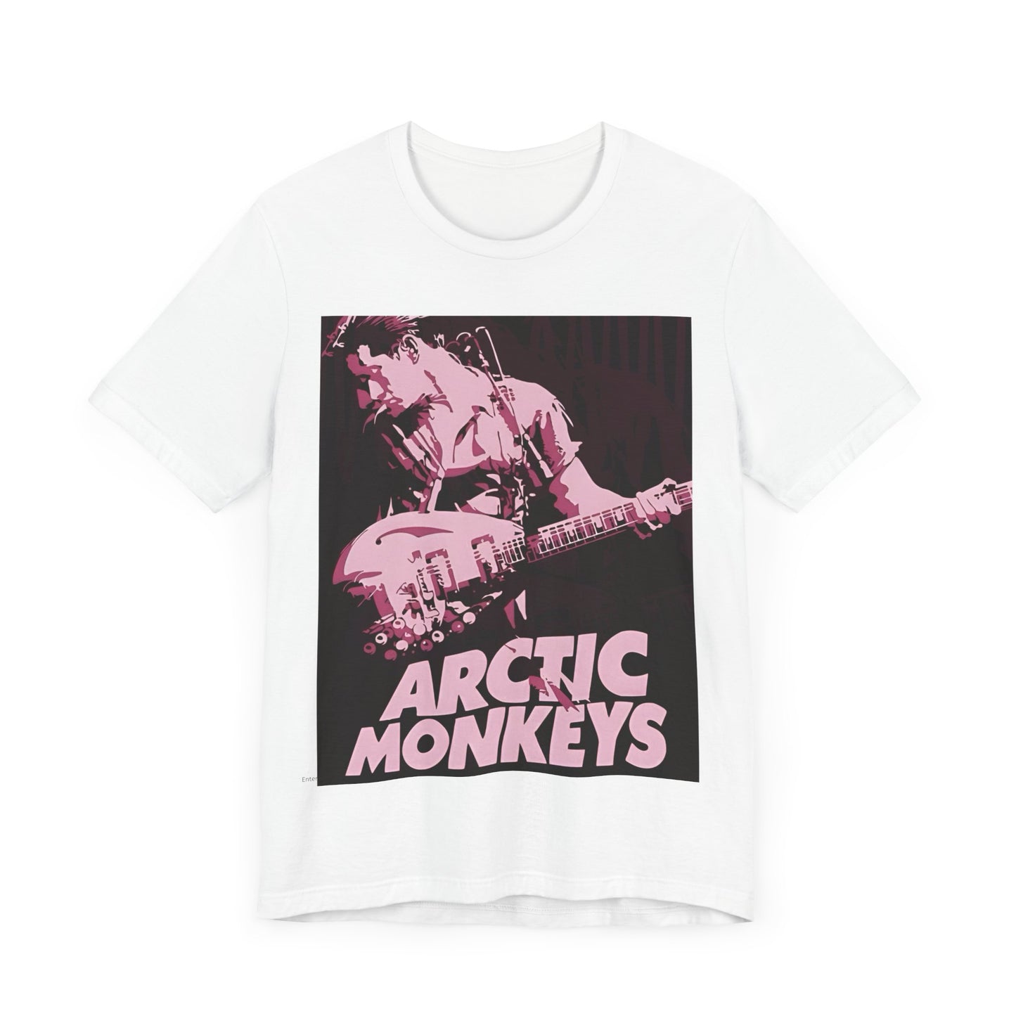 A black graphic t-shirt featuring the Arctic Monkeys logo in a prominent pink color, creating an aesthetic look.