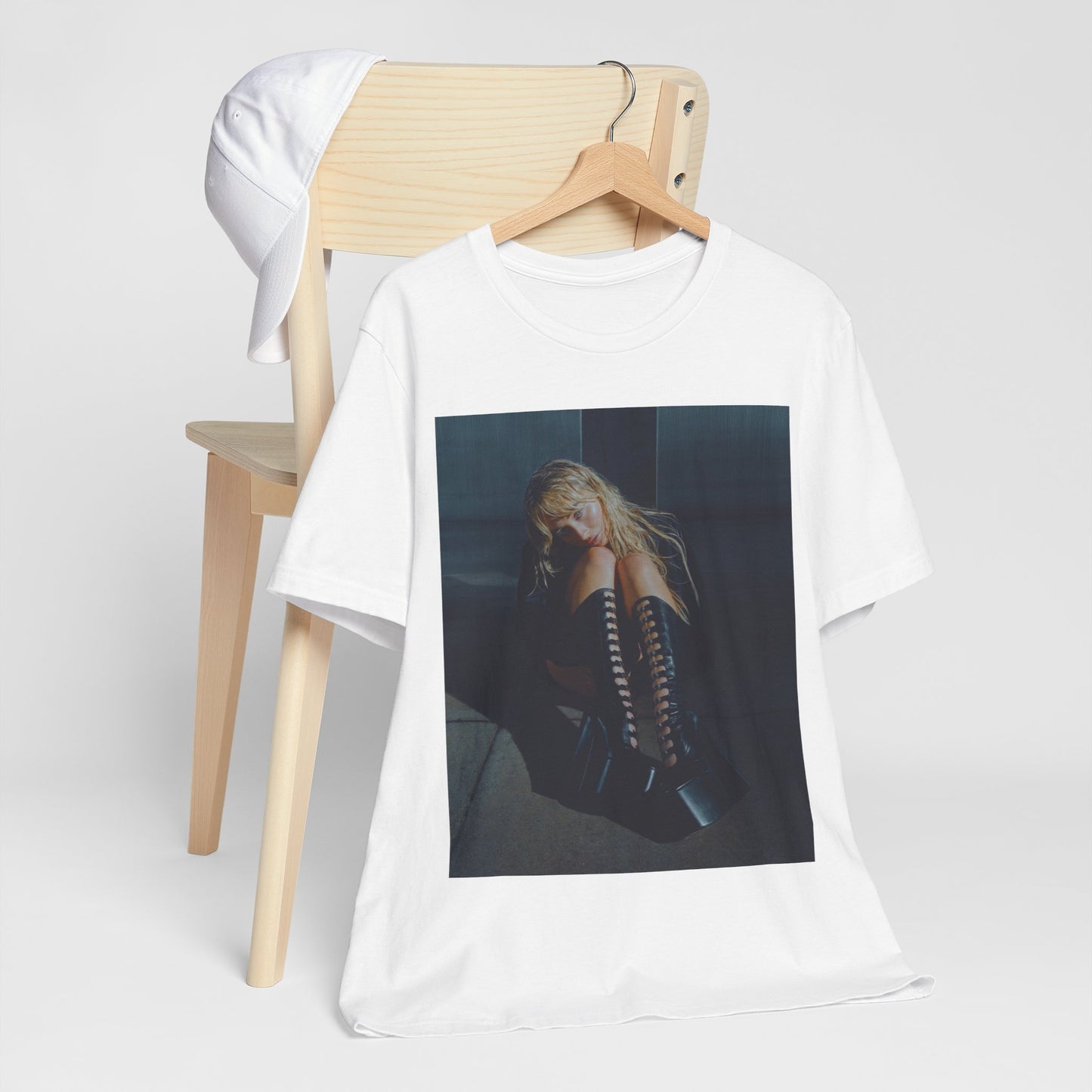 A black graphic t-shirt featuring a bold graphic of Sabrina Carpenter as a pop superstar.