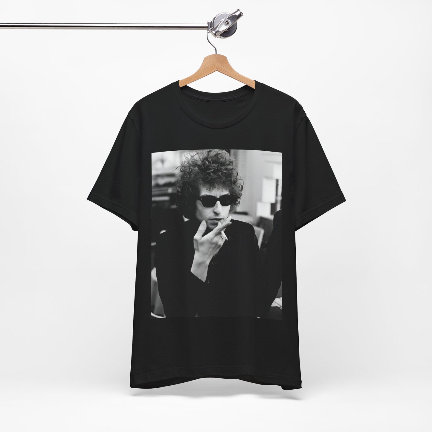 A black graphic t-shirt featuring a retro black and white graphic of Bob Dylan in a rebellious pose.