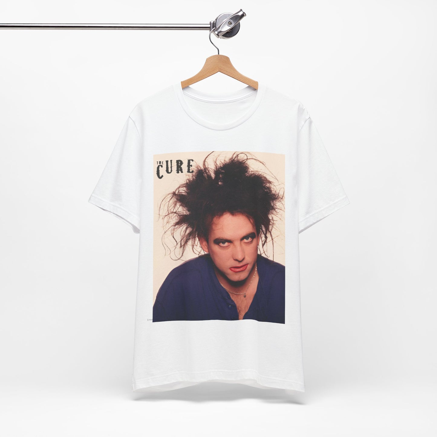 A black graphic t-shirt featuring a photo portrait of Robert Smith from The Cure.