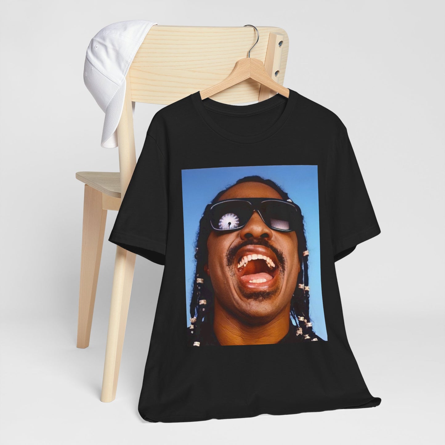 A black graphic t-shirt featuring a bold soul superstar graphic of Stevie Wonder.