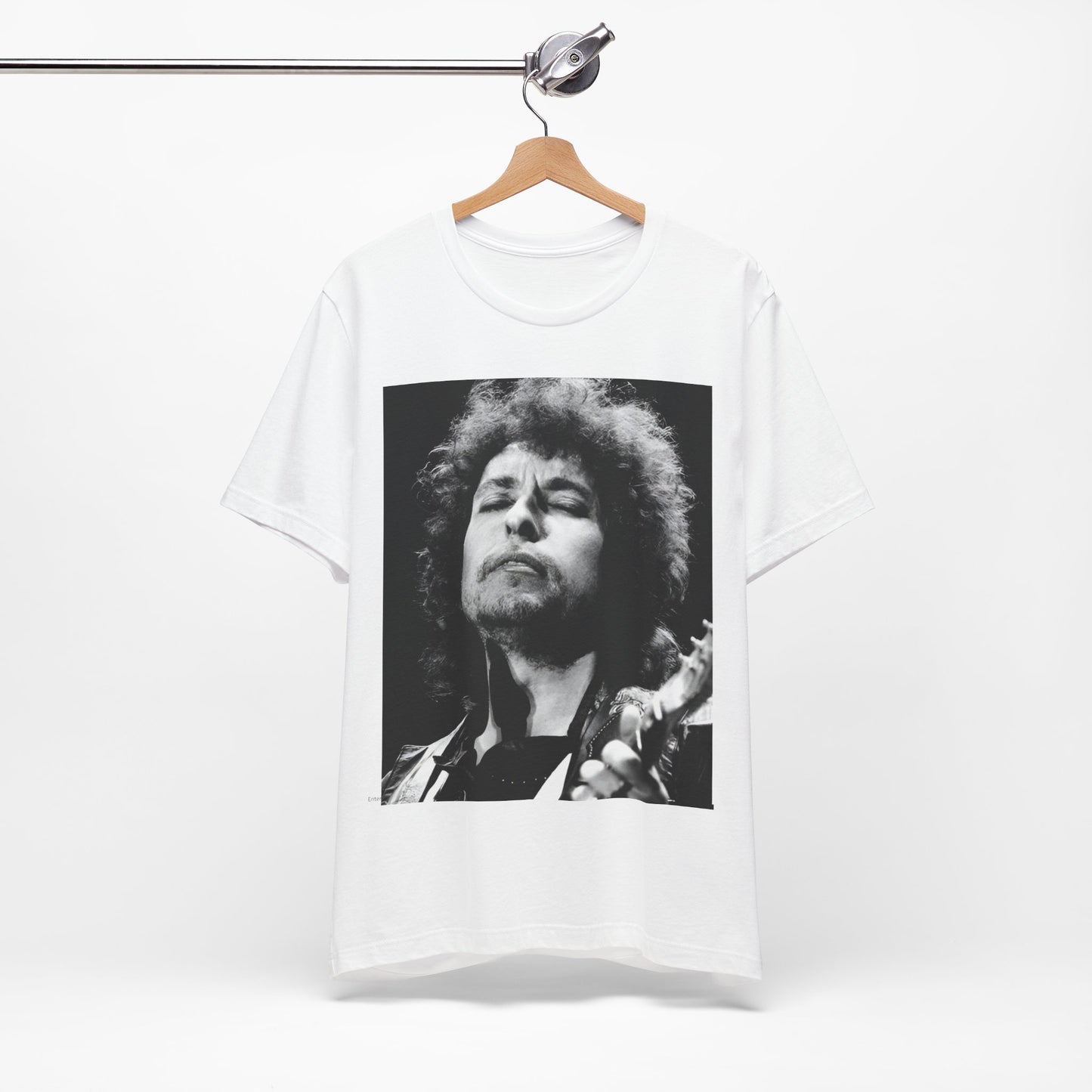 A black graphic t-shirt featuring a retro black and white graphic or photo of Bob Dylan performing live.