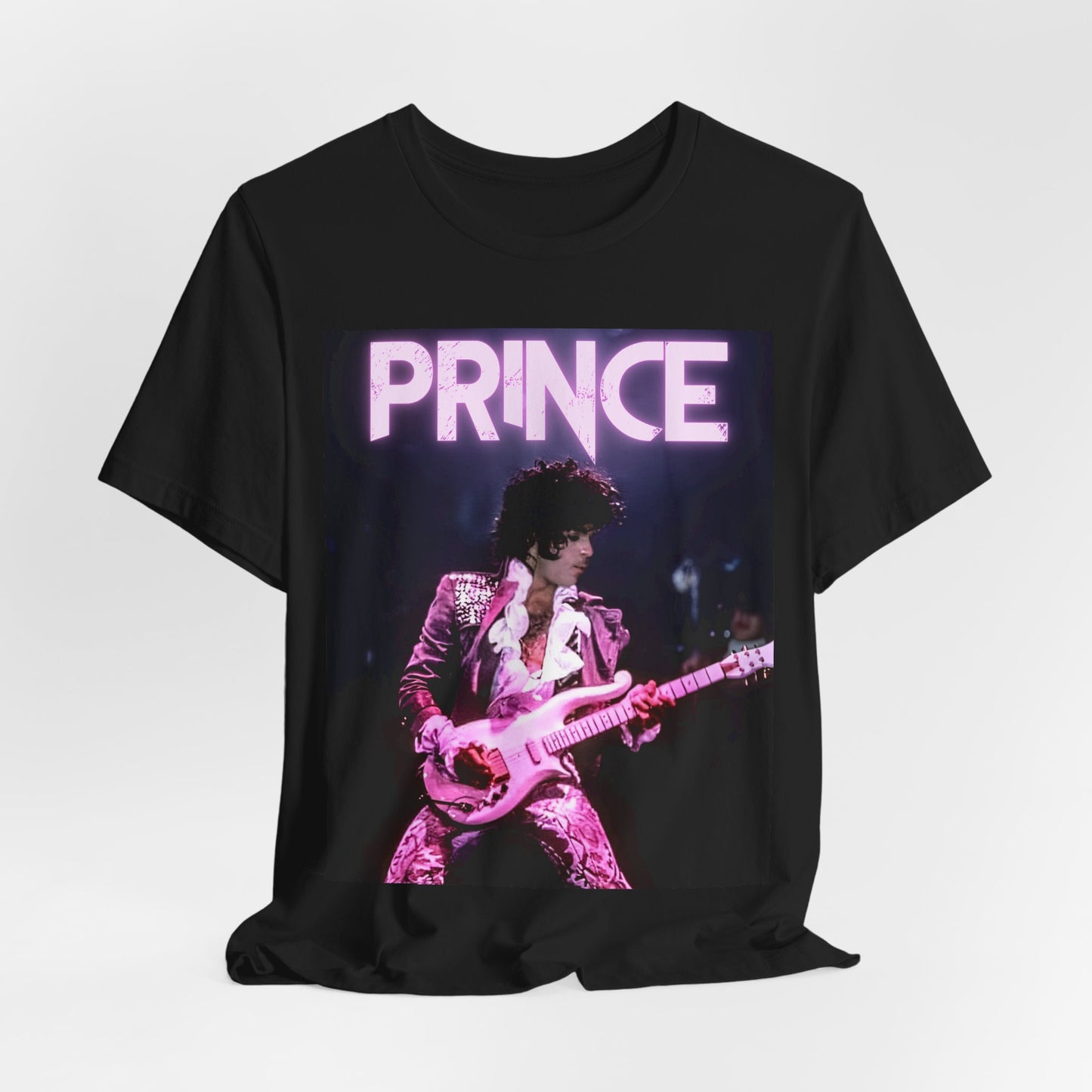 A black graphic t-shirt featuring an 80s pop genius graphic of Prince.