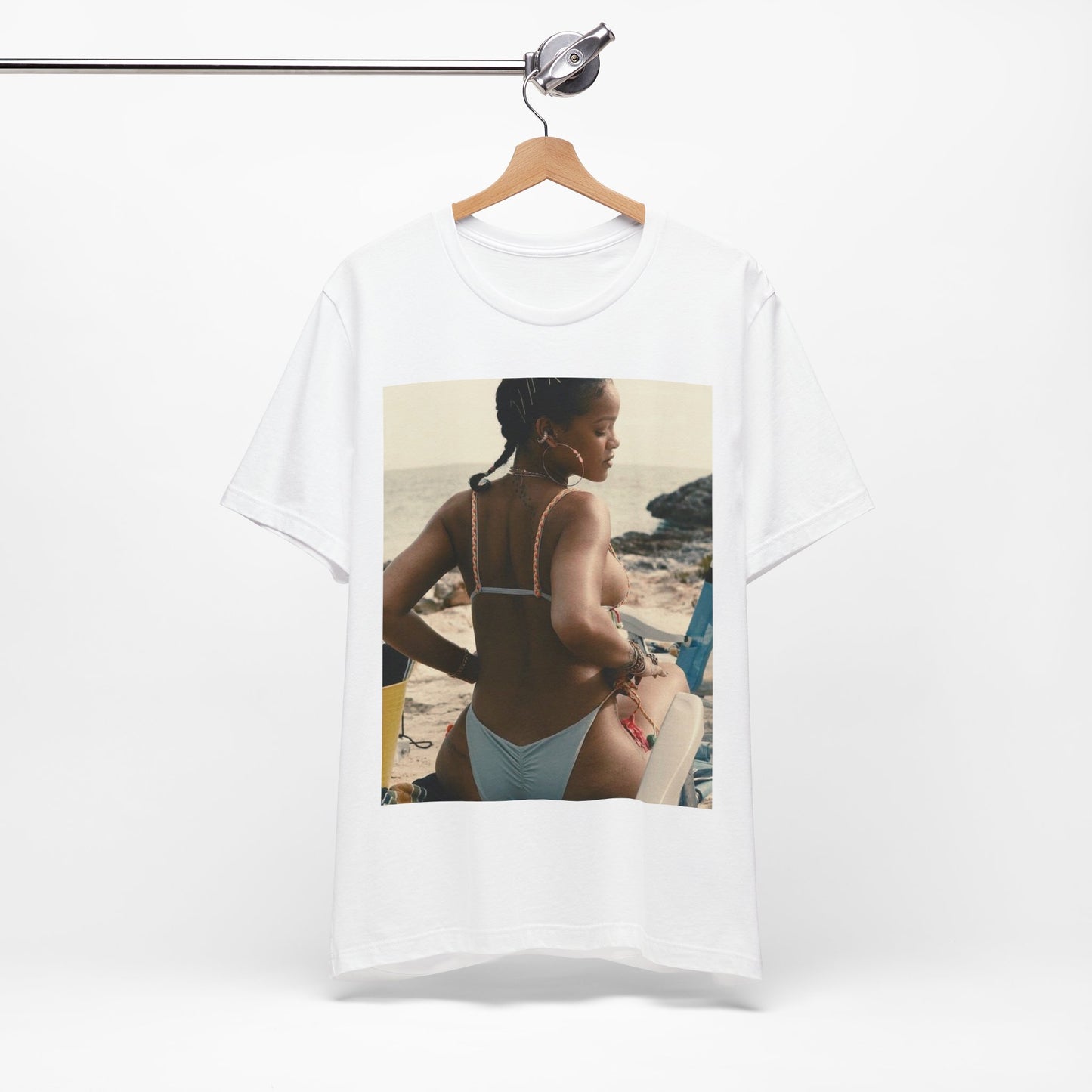 A black graphic t-shirt featuring a graphic of Rihanna as a bikini babe in paradise.