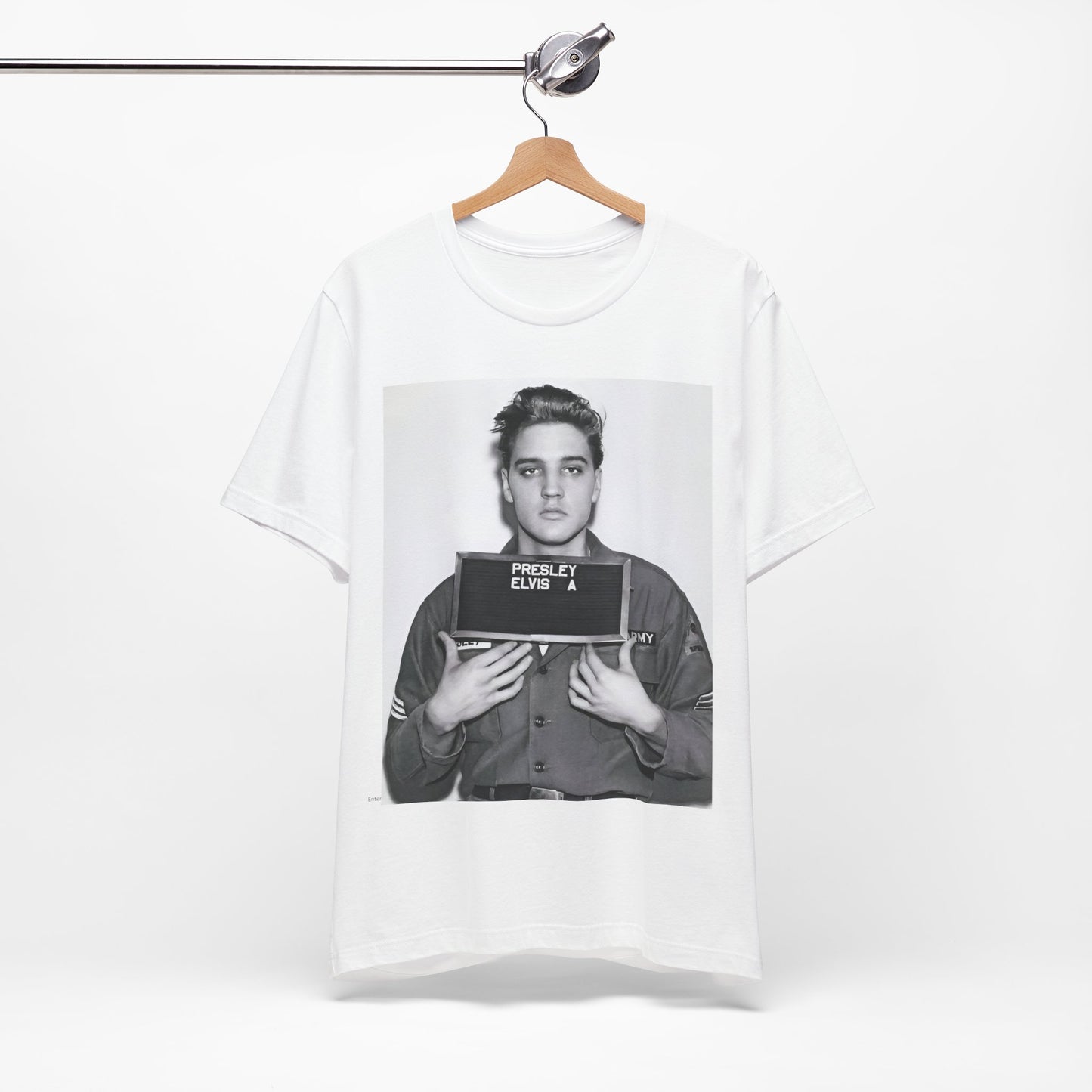 A black graphic t-shirt featuring a retro mugshot photo of Elvis Presley.