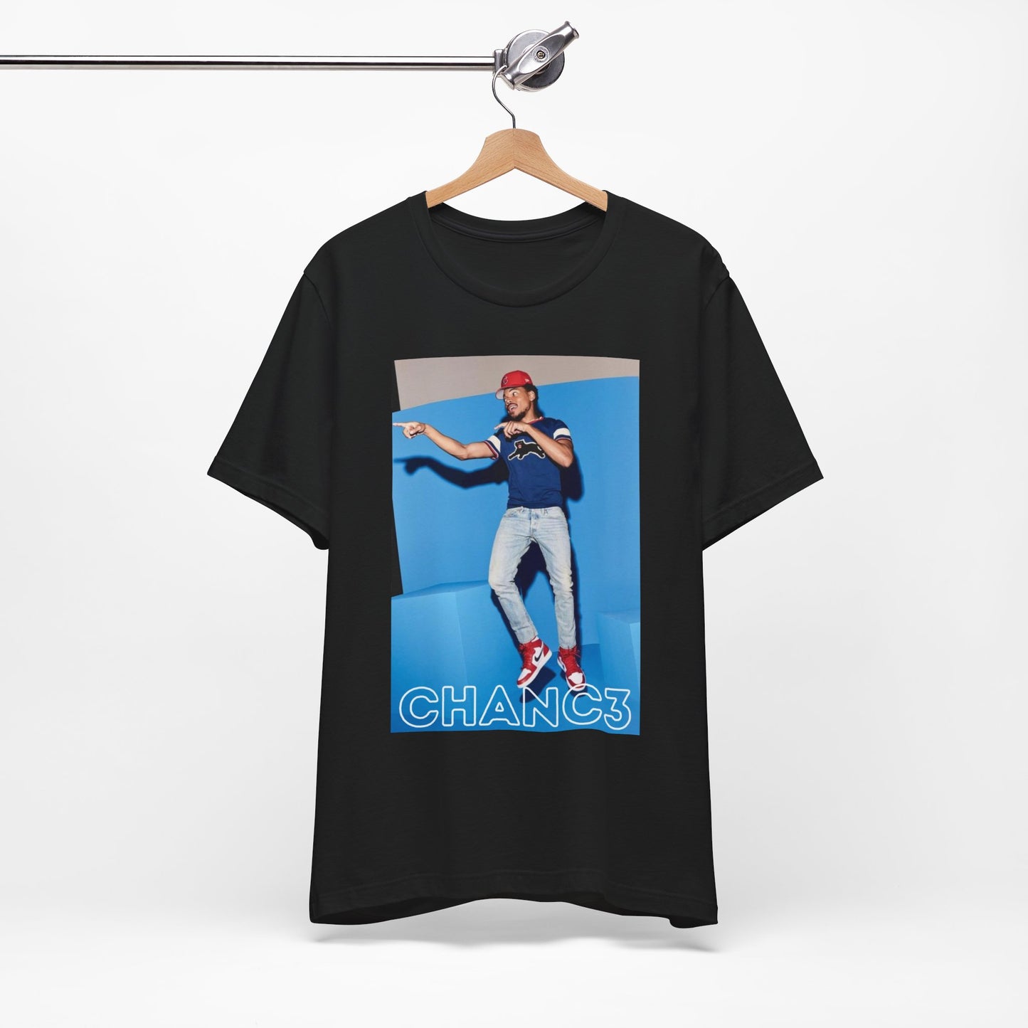 A black graphic t-shirt featuring a graphic of Chance the Rapper emphasizing his gospel rap style.