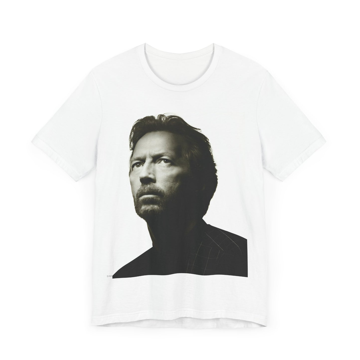 A black graphic t-shirt featuring a retro black and white portrait photo of Eric Clapton.