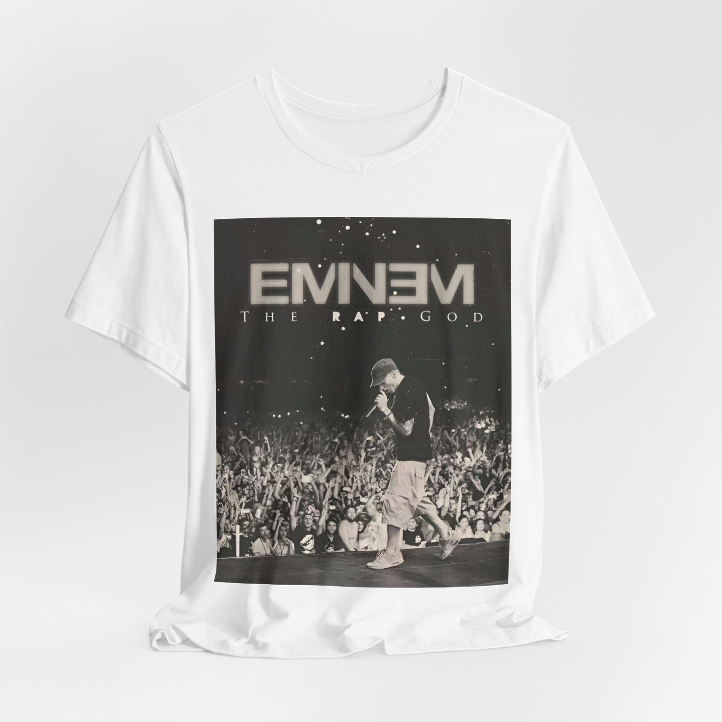 A black graphic t-shirt featuring a graphic or photo of Eminem performing live on tour.