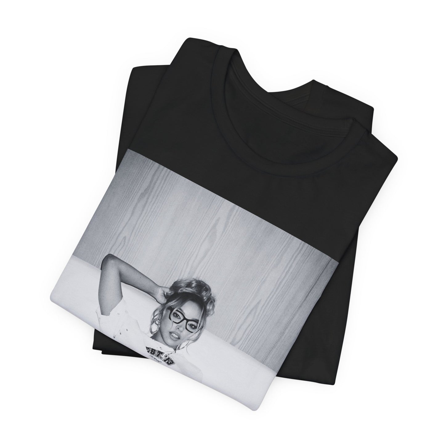 A black graphic t-shirt featuring a black and white portrait photo of Tinashe.