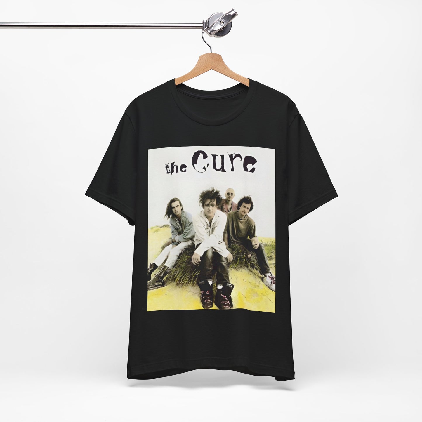 A black graphic t-shirt featuring a graphic of The Cure as post-punk pioneers.