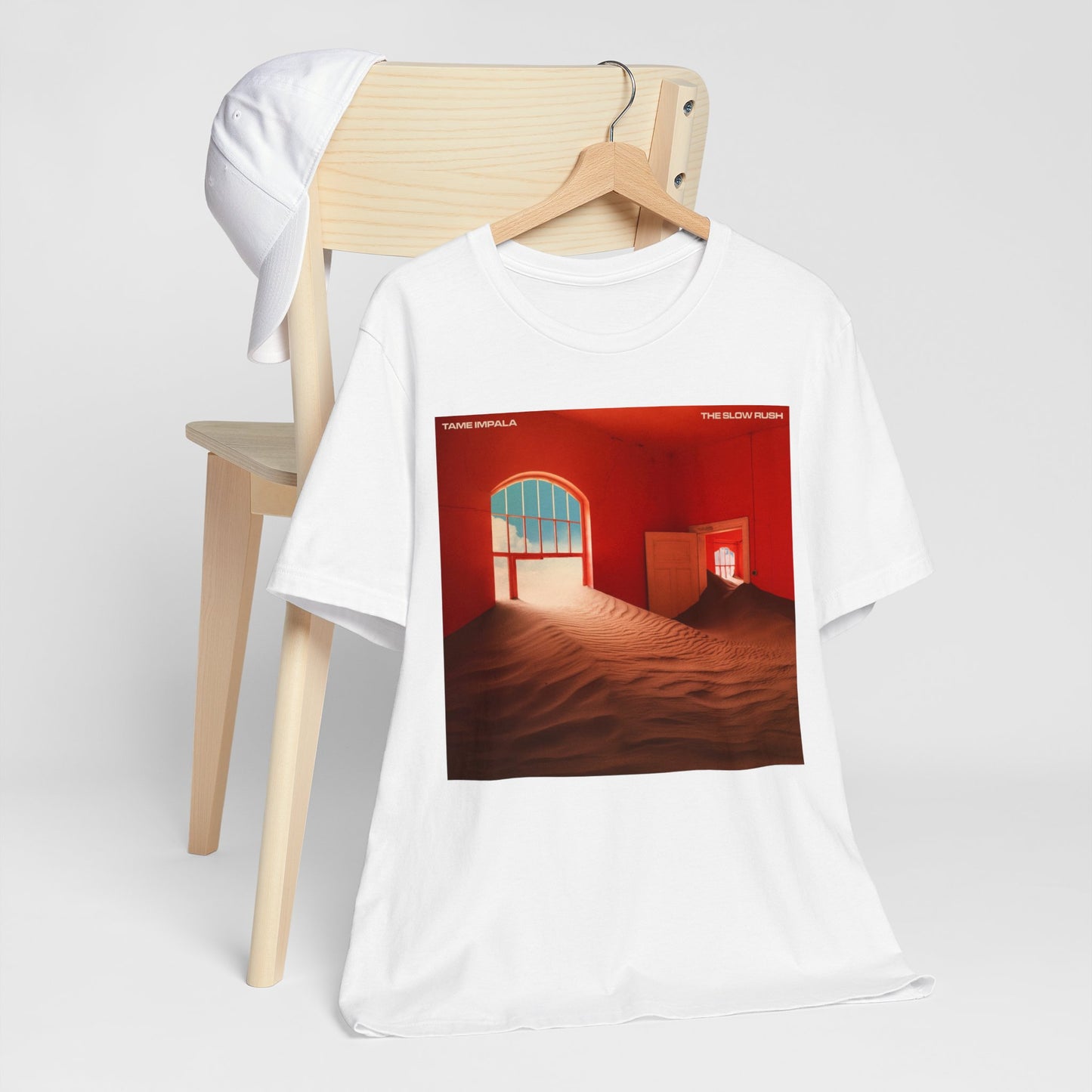 A black graphic t-shirt featuring a graphic related to Tame Impala's 'The Slow Rush' album.