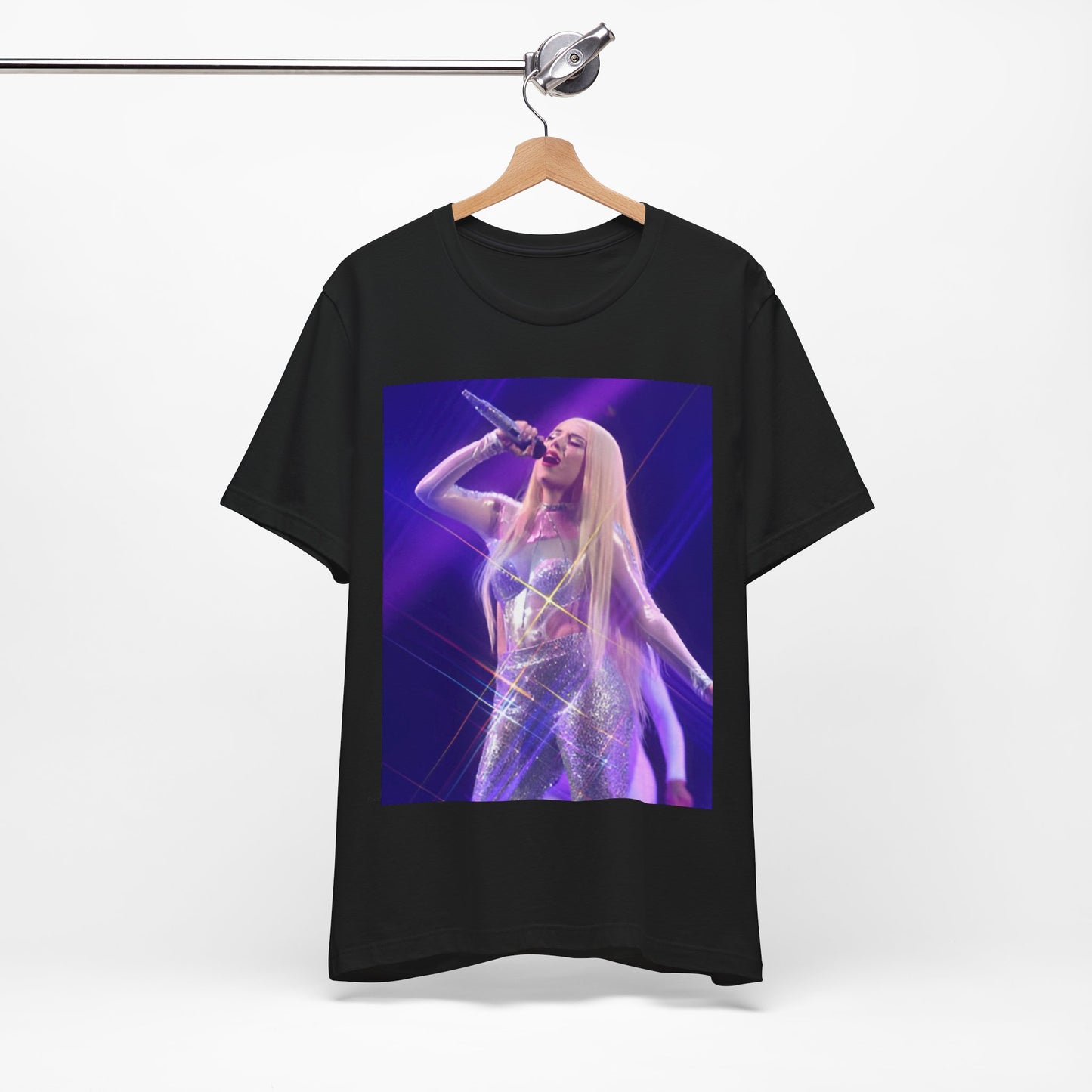 A black graphic t-shirt featuring a photo or illustration of Ava Max performing on stage, with a glittering or sparkling effect.