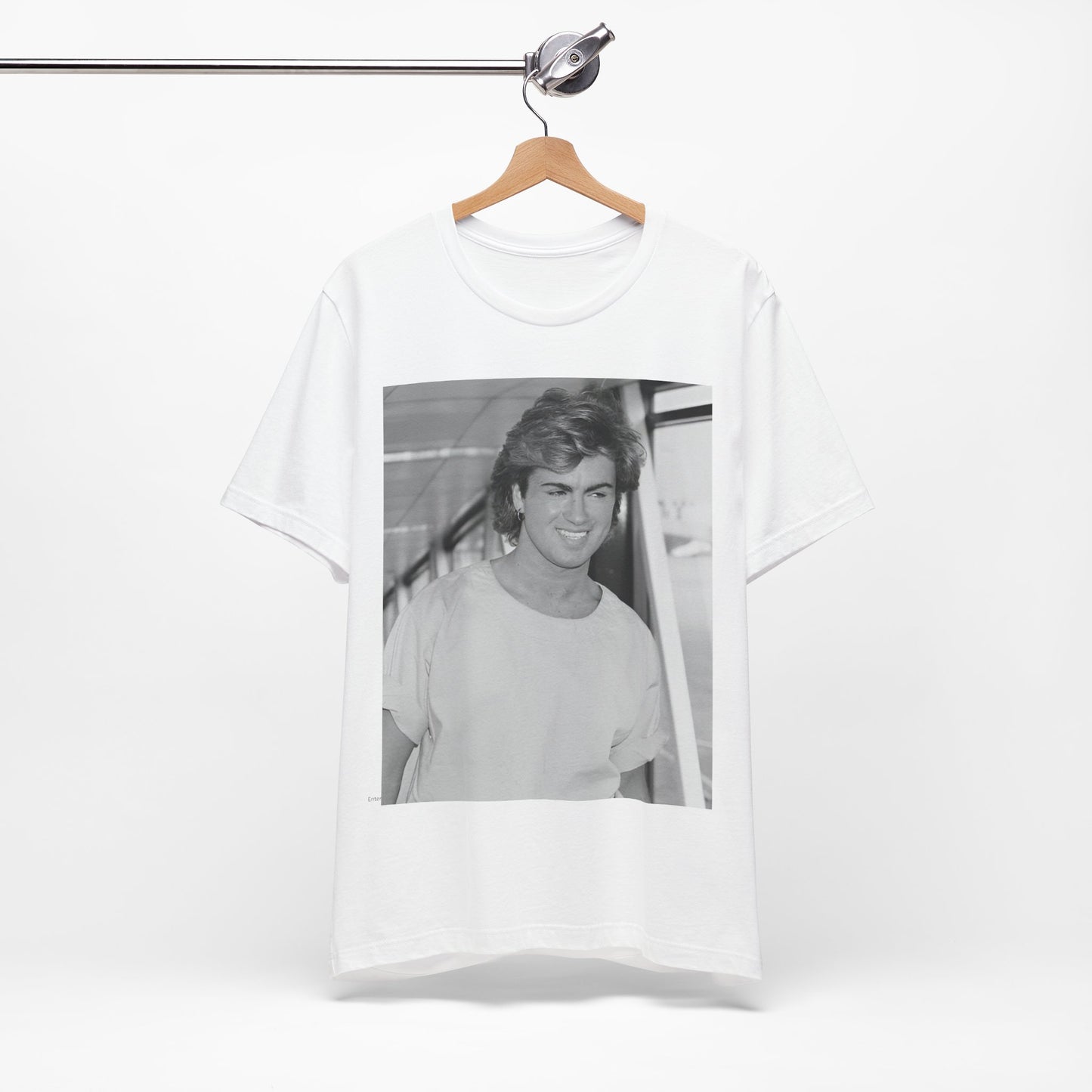 A black graphic t-shirt featuring an 80s black and white vintage photo or graphic of George Michael.
