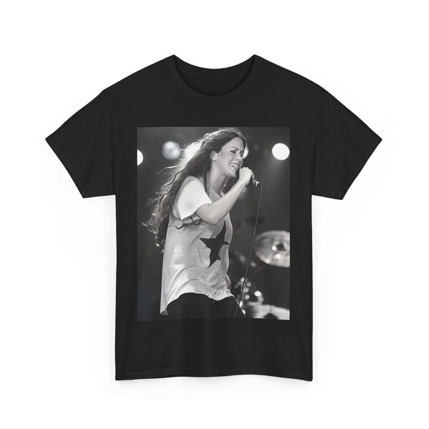 A black graphic t-shirt featuring a photo of Alanis Morissette performing live on stage in the 1990s, with a dynamic expression.