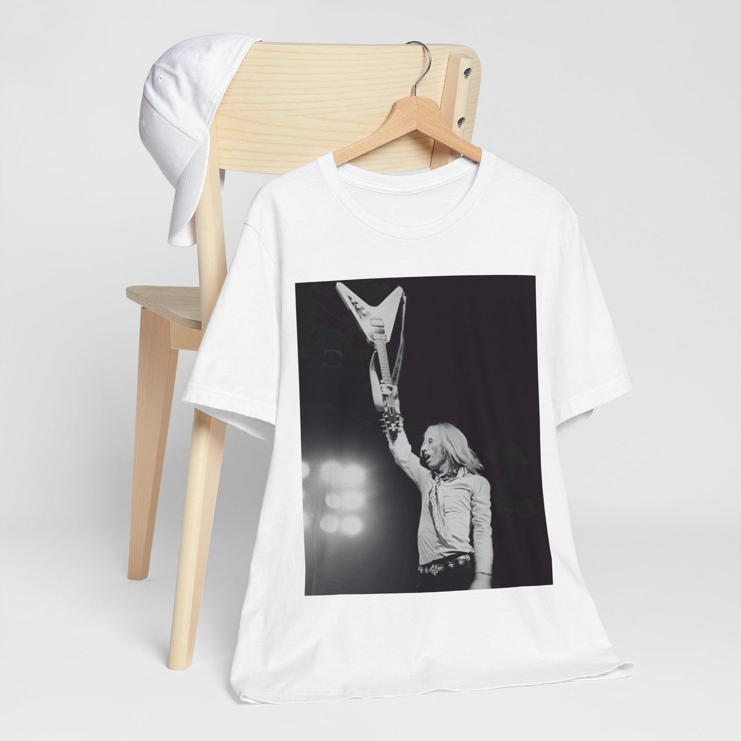 A black graphic t-shirt featuring a graphic or photo of Tom Petty playing guitar on stage.