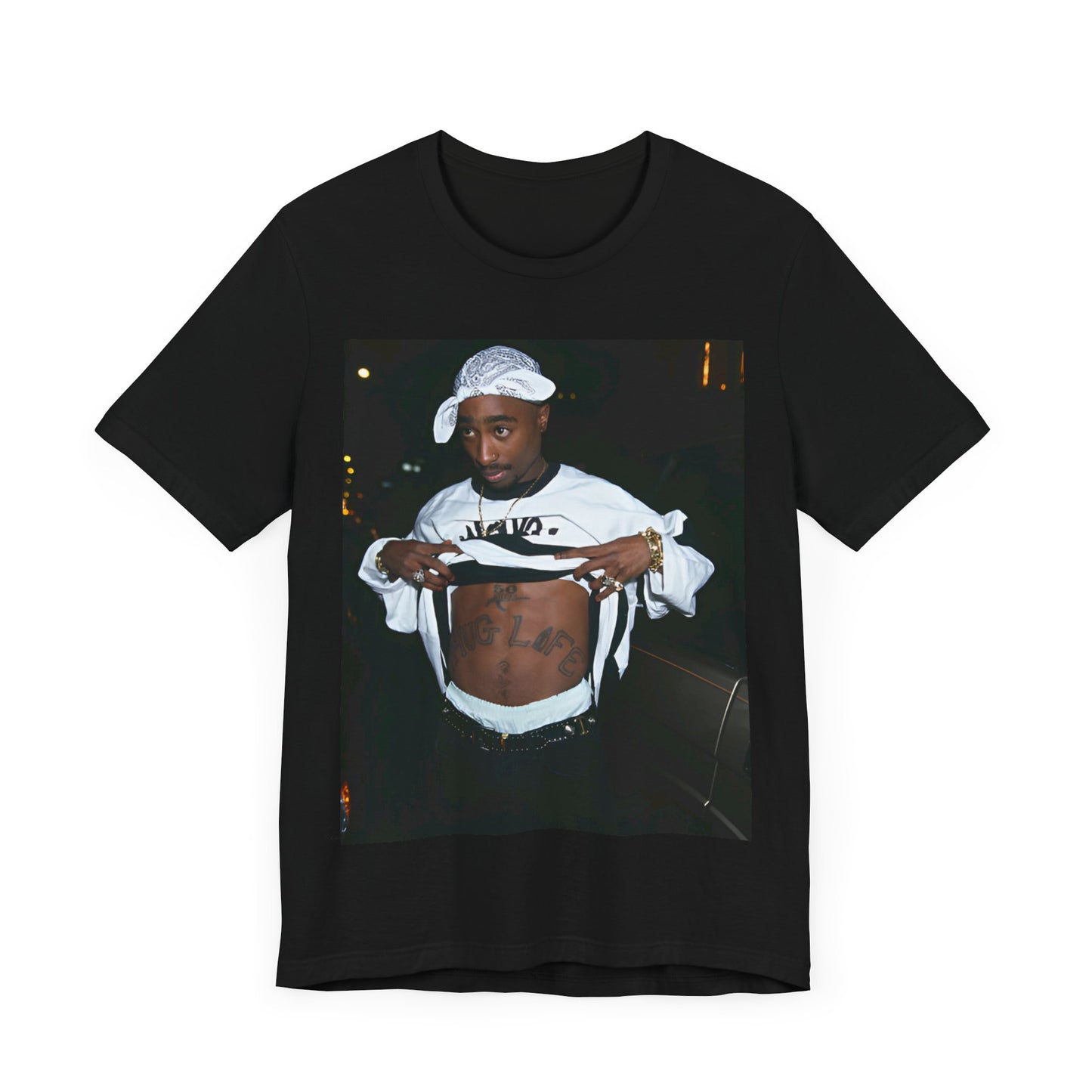 A black graphic t-shirt featuring a graphic of Tupac Shakur (2Pac).