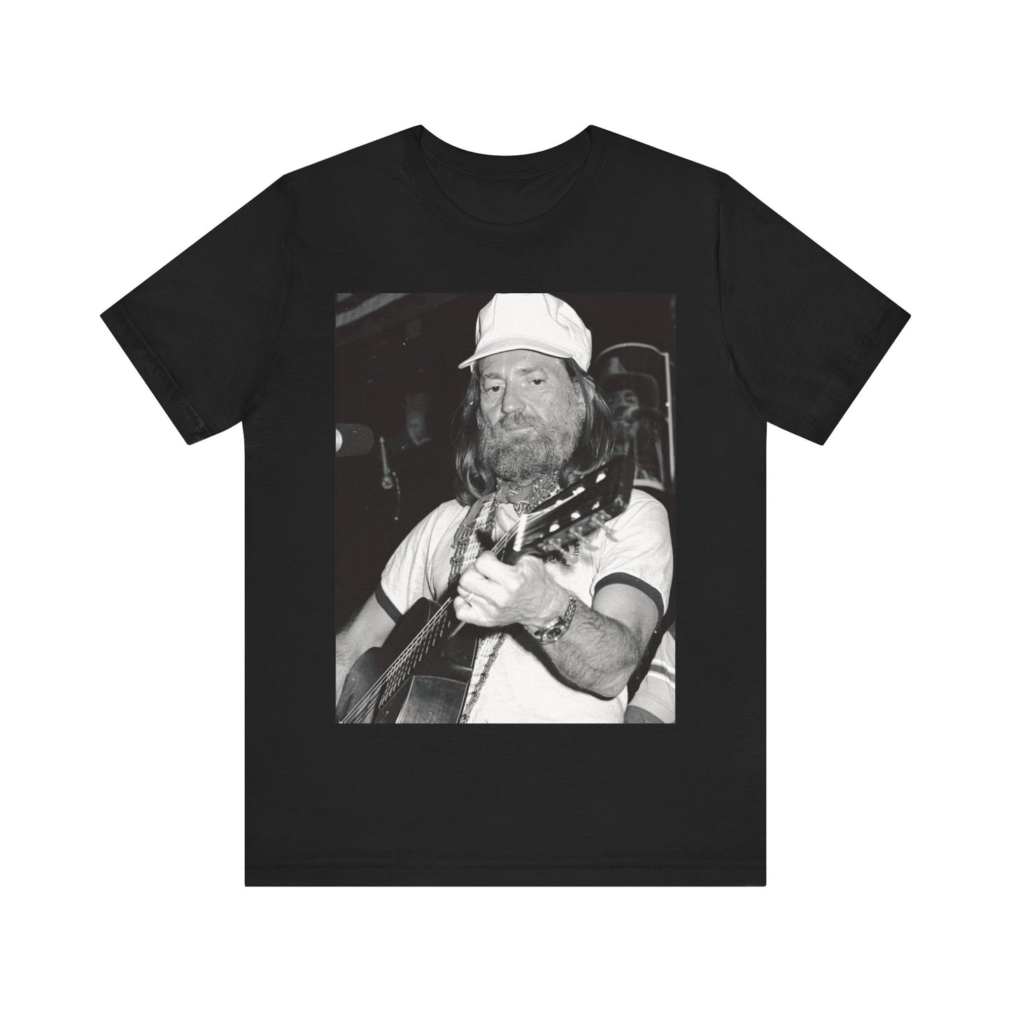 A black graphic t-shirt featuring a 70s cool free spirit graphic of Willie Nelson.