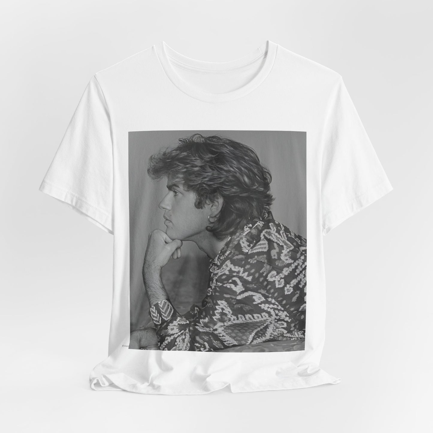 A black graphic t-shirt featuring a graphic of George Michael from his 80s Wham! era.