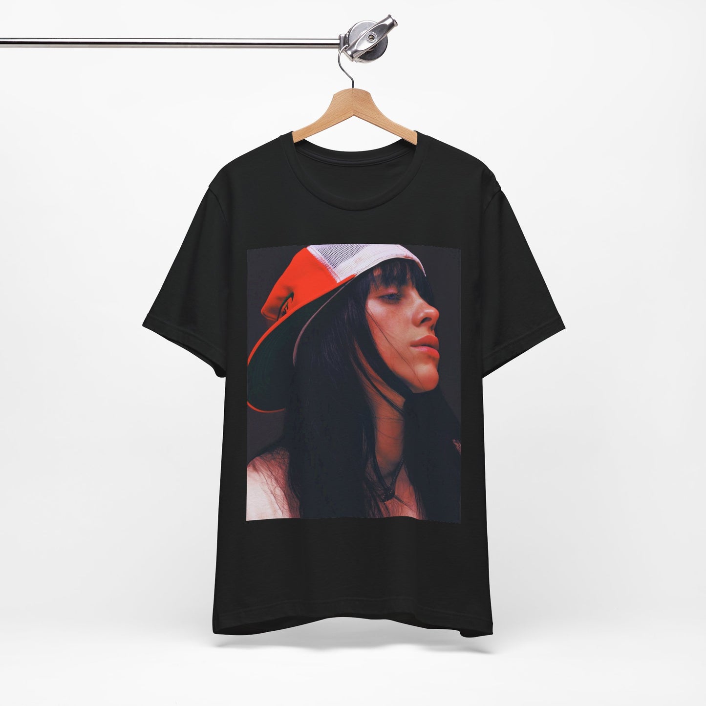 A graphic t-shirt featuring the name 'Billie Eilish' in a raw, urban street-style font.