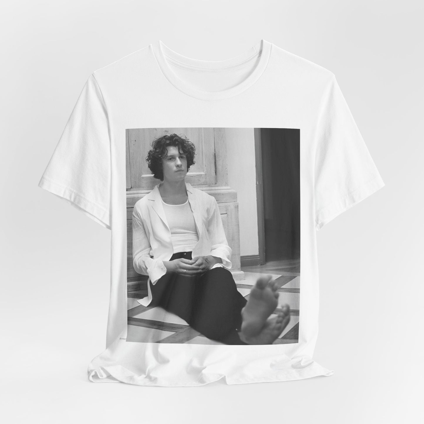 A black graphic t-shirt featuring a vintage casual style graphic of Shawn Mendes.
