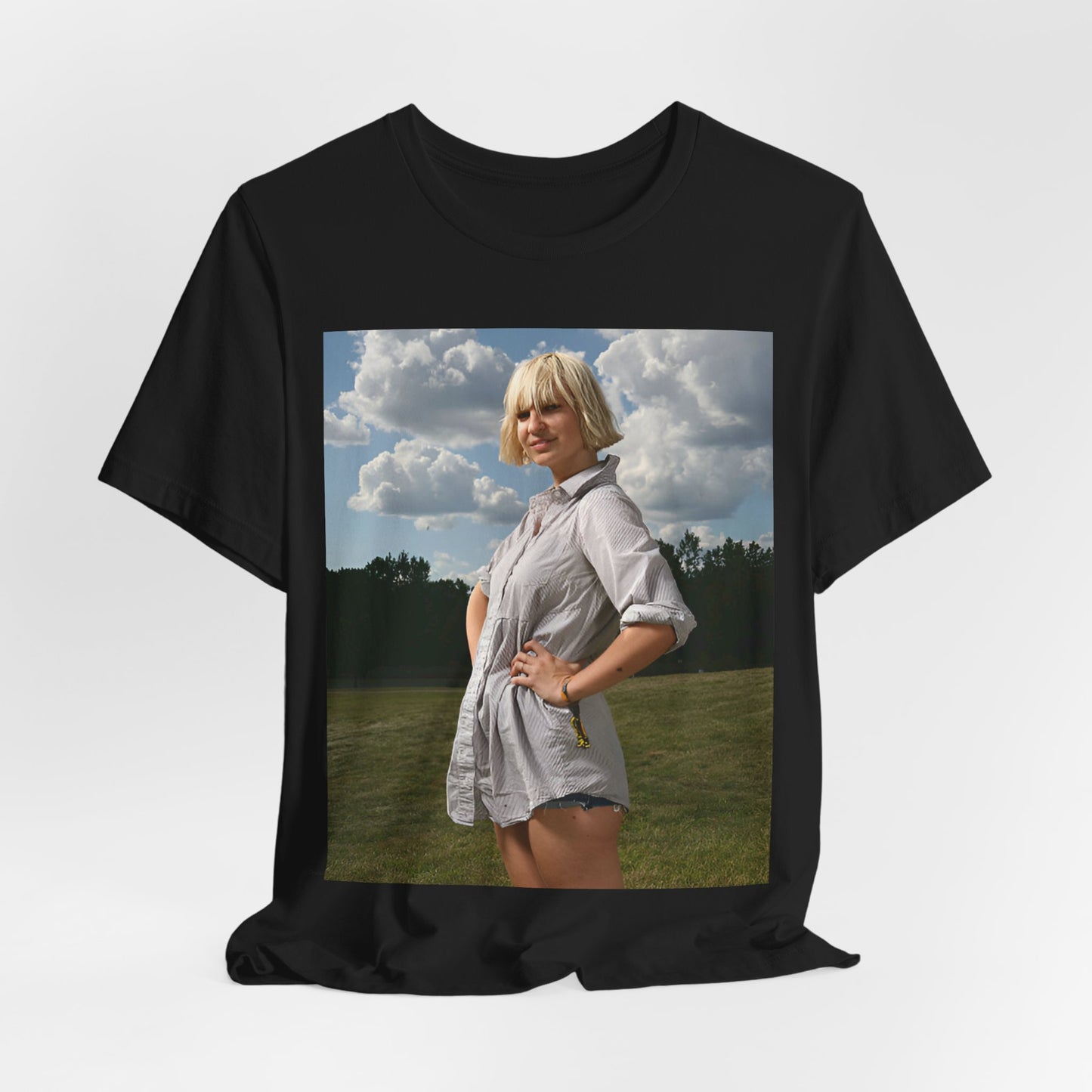 A black graphic t-shirt featuring a bold graphic of Sia as a pop superstar.