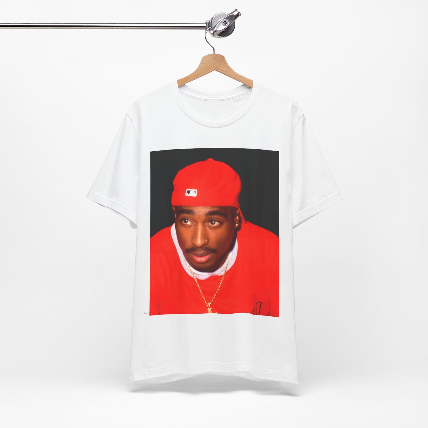A black graphic t-shirt featuring a fierce graphic related to Tupac's 'California Love' song or era.