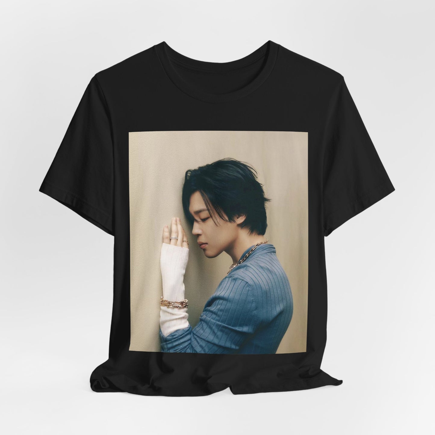A black graphic t-shirt featuring a cool K-Pop idol essential graphic of Jimin.