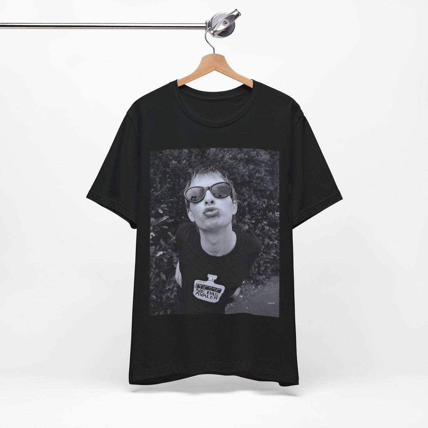 A black graphic t-shirt featuring a retro 90s graphic of Thom Yorke from Radiohead.