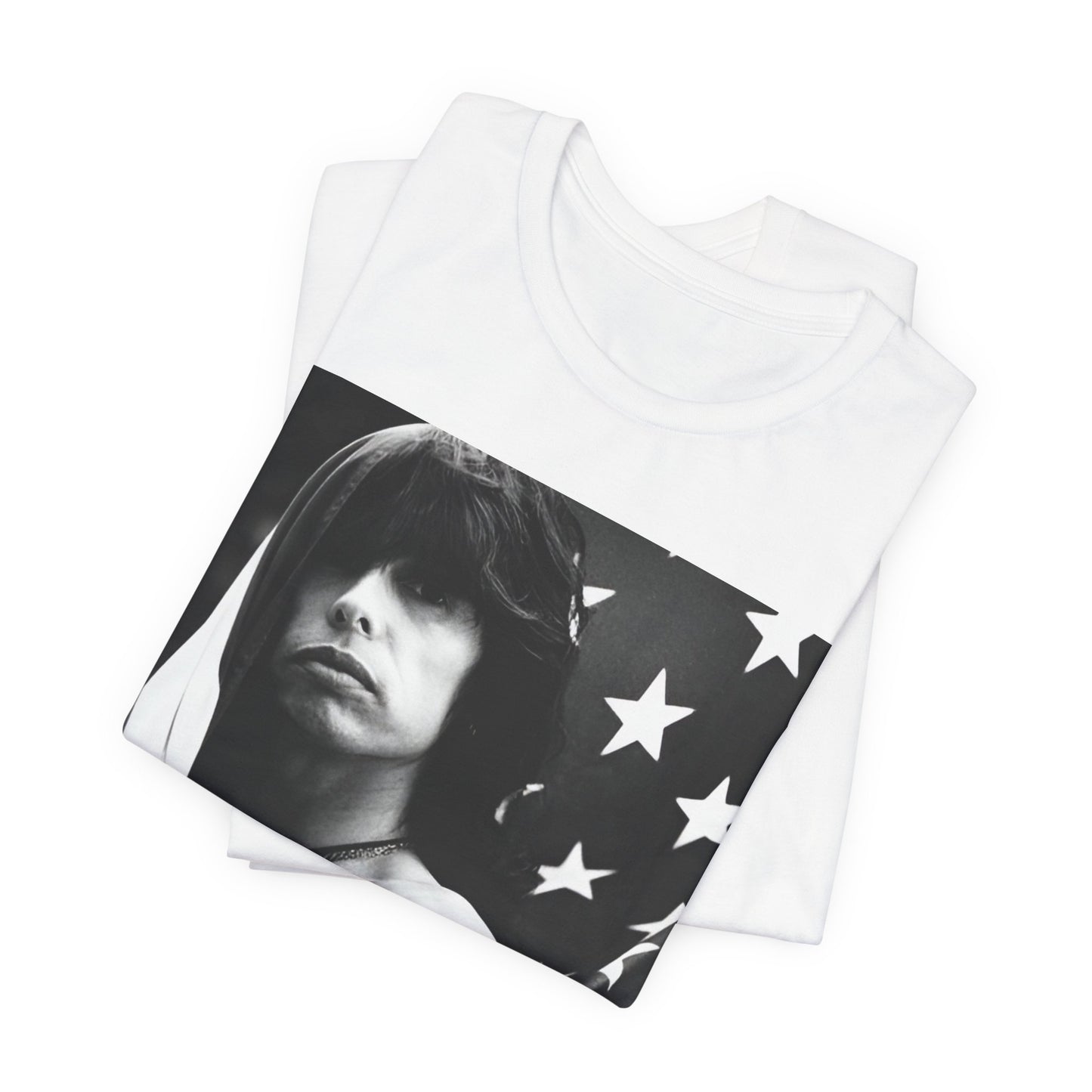 A black graphic t-shirt featuring a retro 70s-style illustration or photo of Aerosmith, integrated with elements of the American flag.
