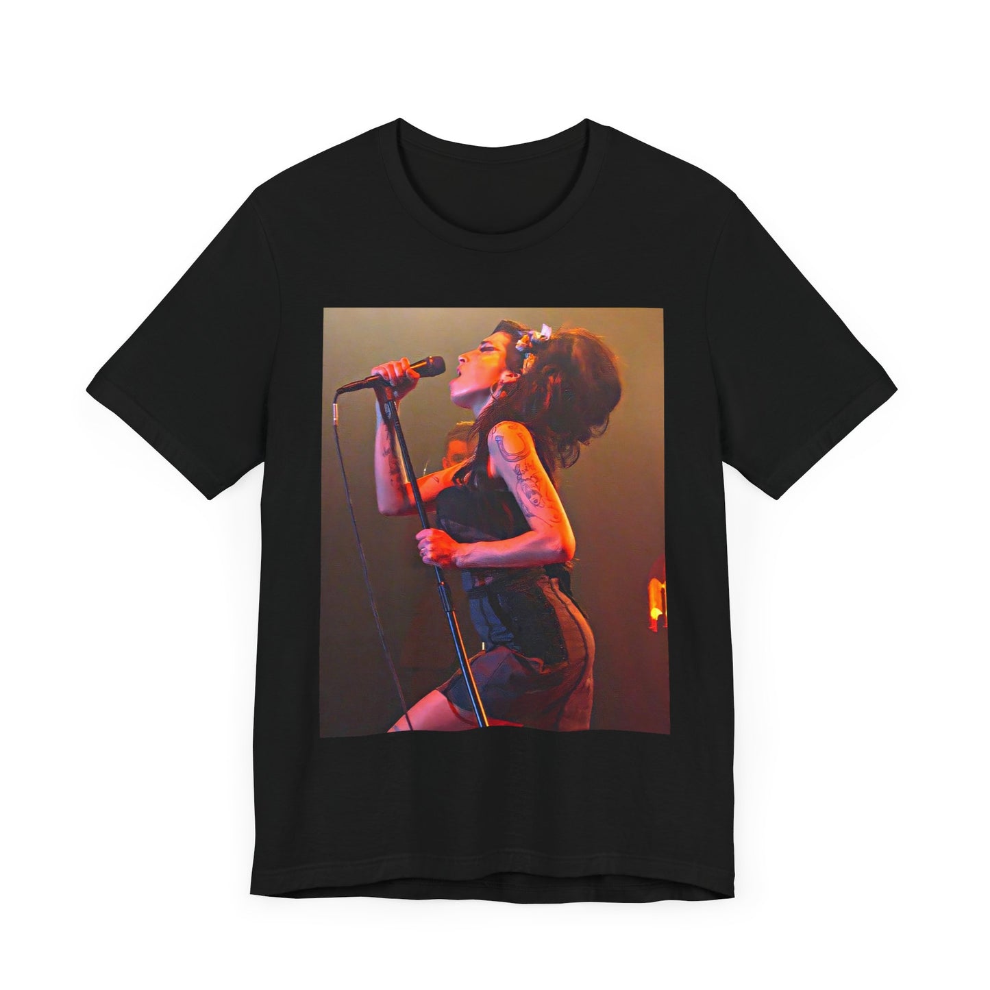 A black graphic t-shirt featuring a dynamic photo of Amy Winehouse performing live, with elements suggesting her 'Back to Black' era.