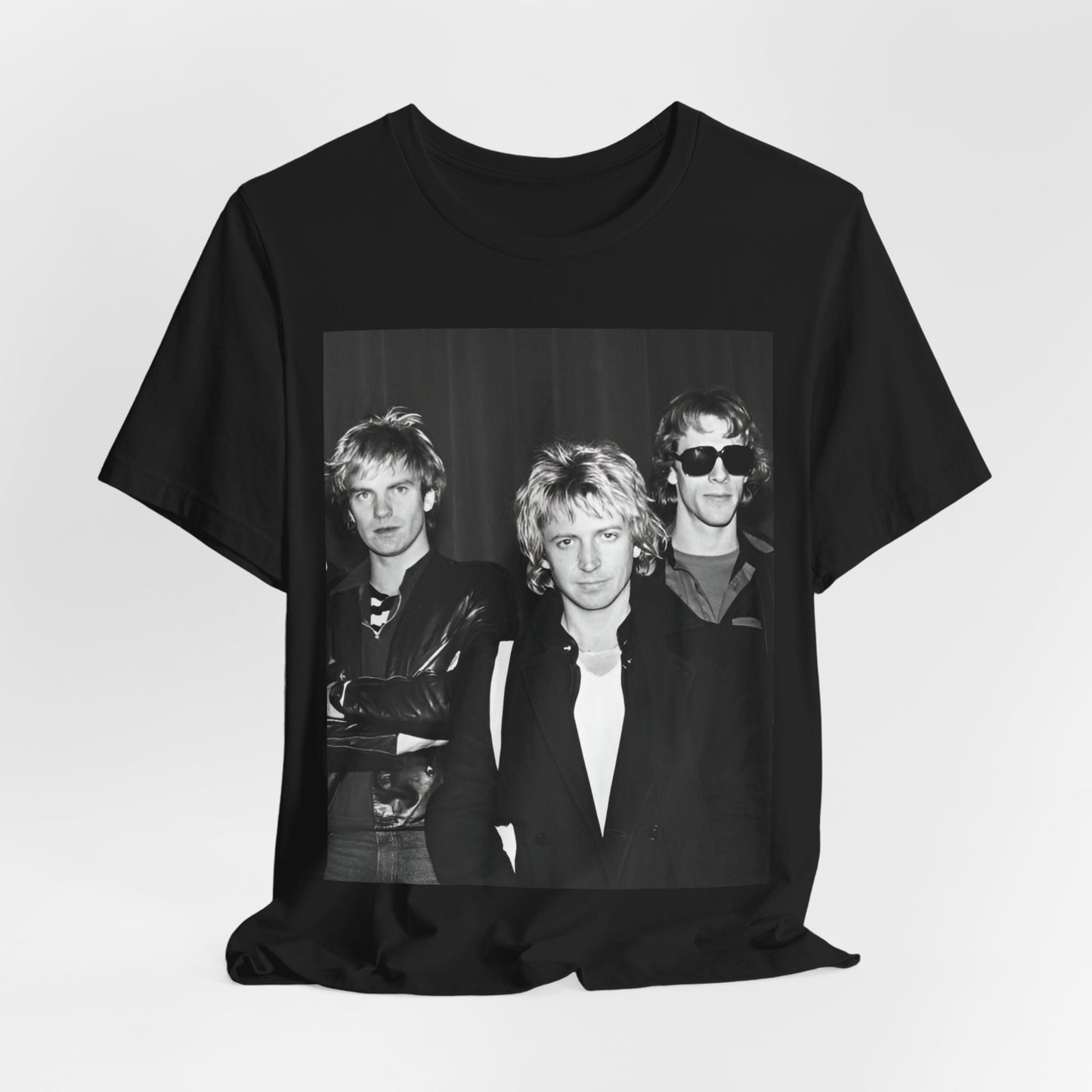 A black graphic t-shirt featuring a black and white, monochrome graphic or photo of The Police.