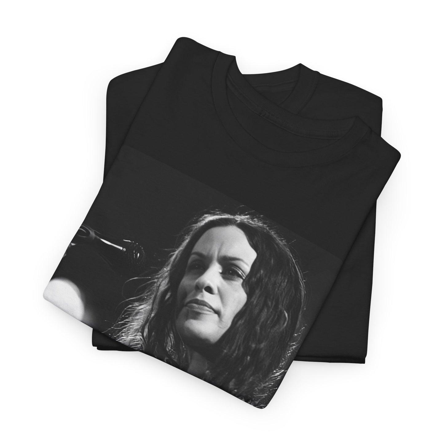 A black graphic t-shirt featuring a 90s-style graphic of Alanis Morissette playing a guitar, with a dynamic expression.