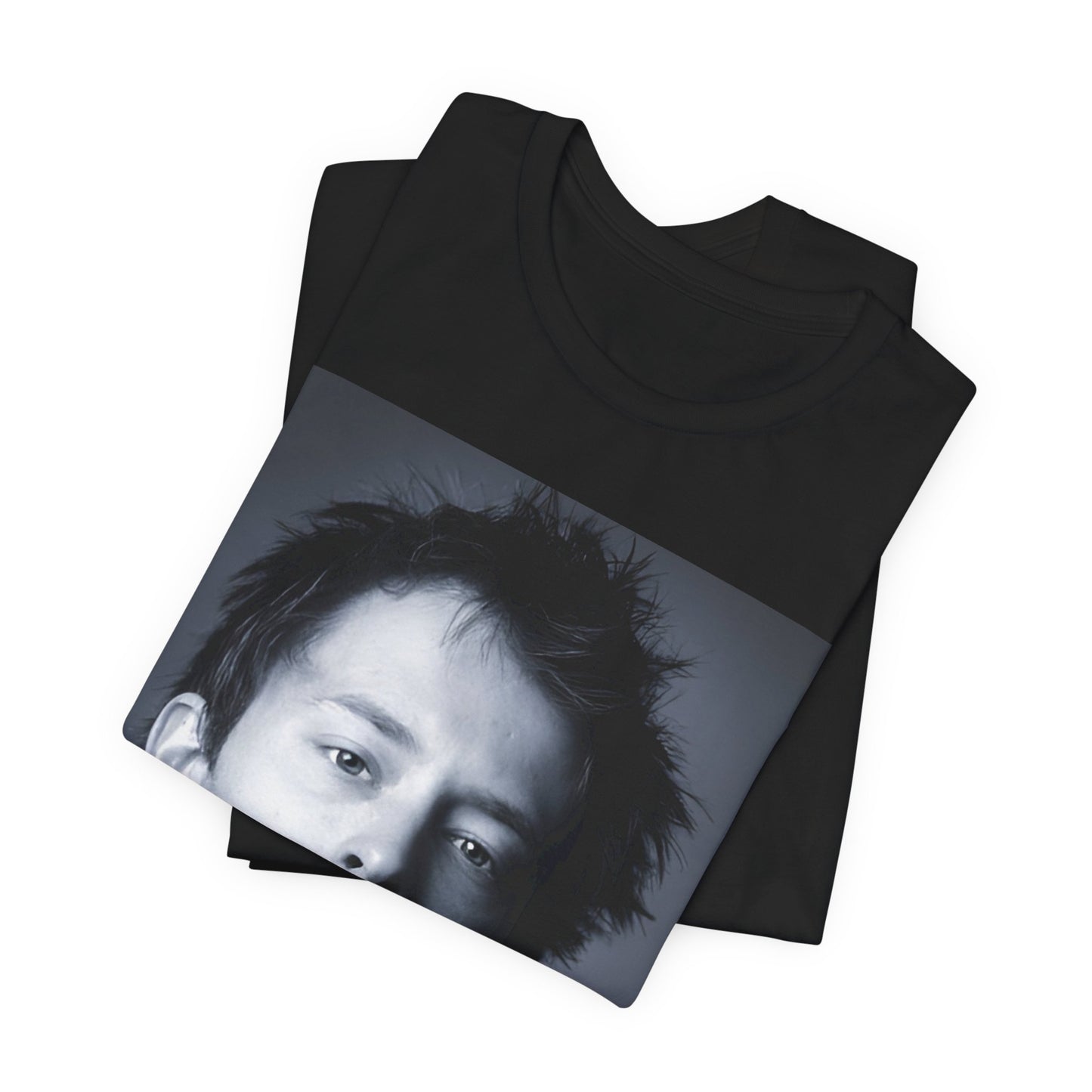 A black graphic t-shirt featuring an enigmatic graphic of Thom Yorke from Radiohead as a frontman.