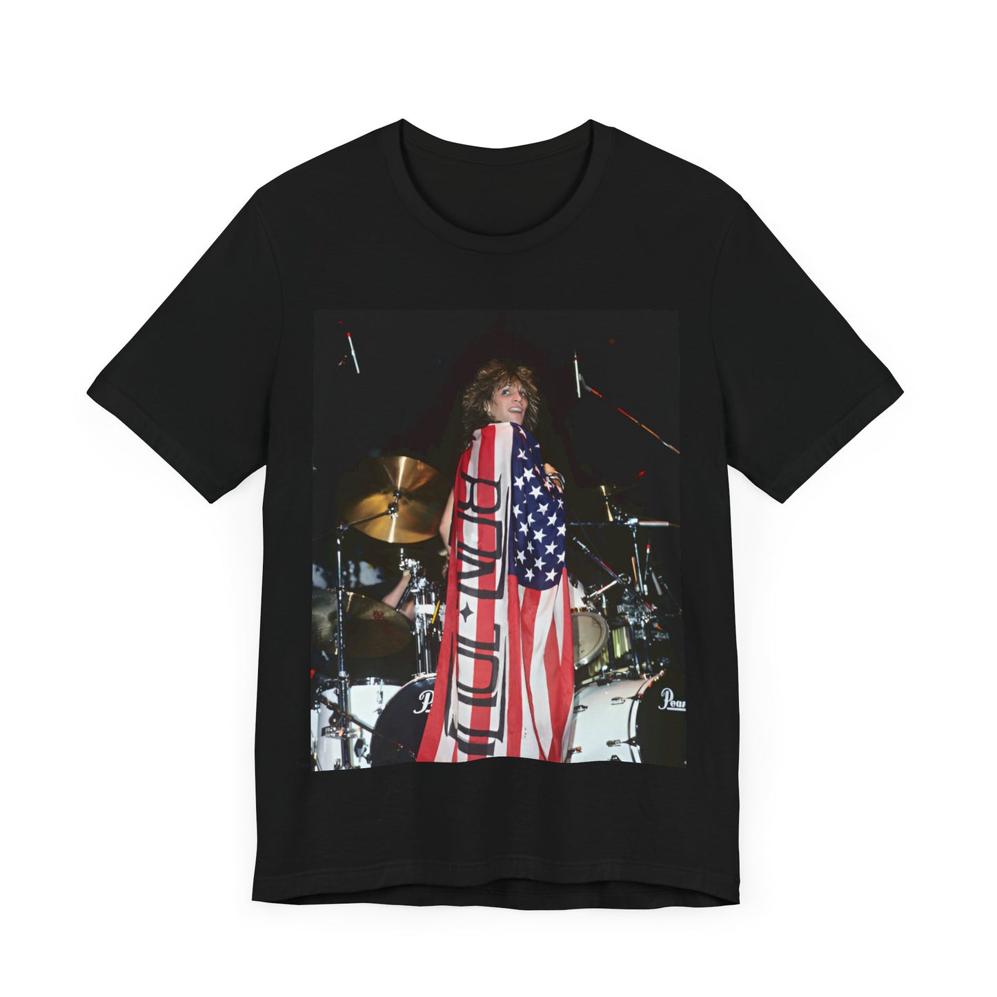 A black graphic t-shirt featuring a graphic of Bon Jovi performing on stage with an American flag as a backdrop.