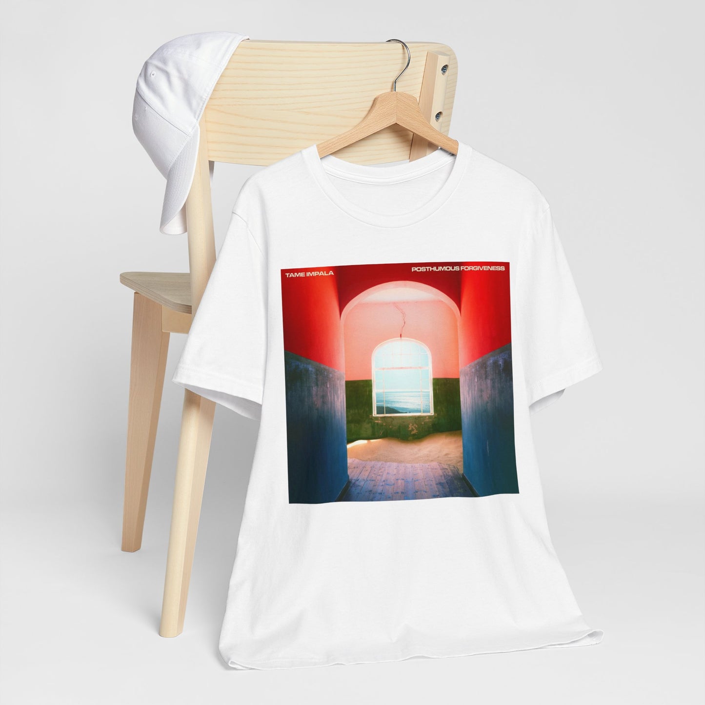 A black graphic t-shirt featuring a graphic related to Tame Impala's song 'Posthumous Forgiveness'.