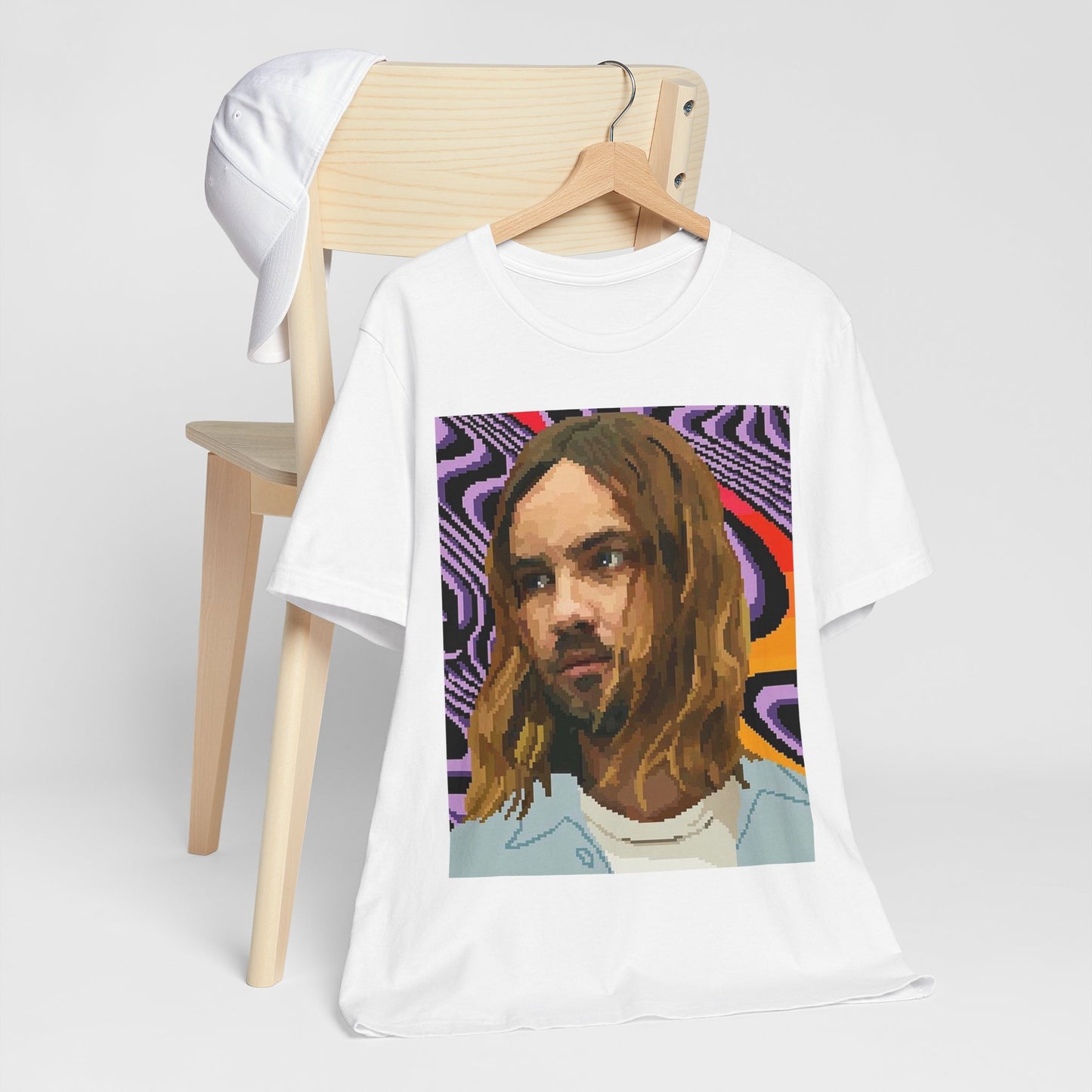 A black graphic t-shirt featuring a vintage graphic of Tame Impala with mind-bending visuals.