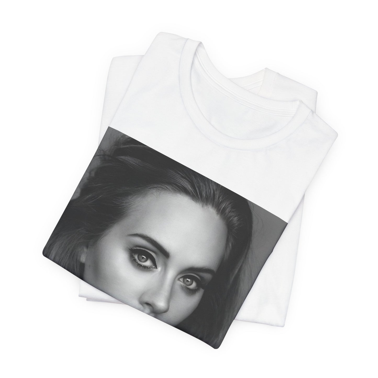 A black graphic t-shirt featuring a classic black and white, monochrome portrait of Adele, showing her with a serene or thoughtful expression.