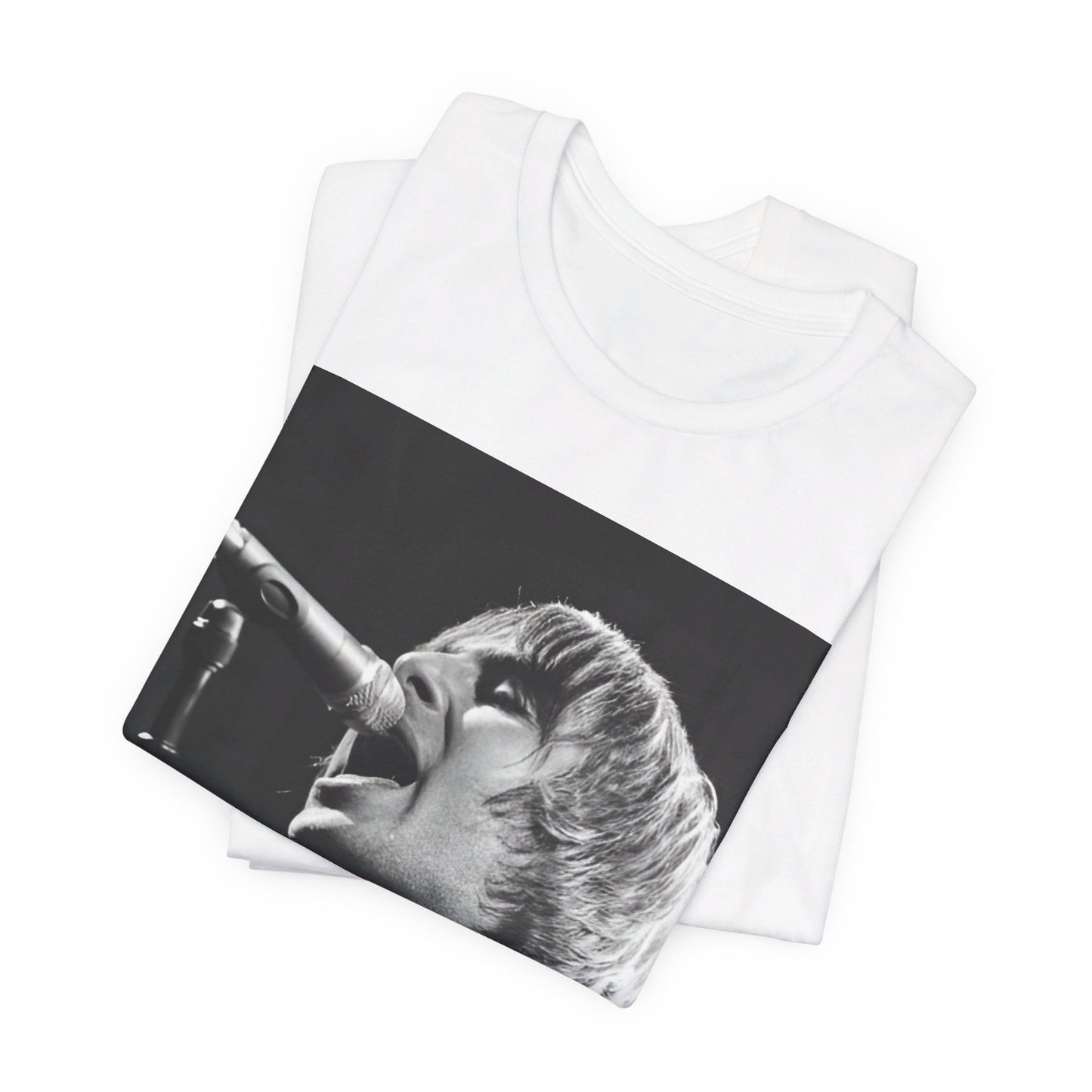 A black graphic t-shirt featuring a black and white graphic or photo of Liam Gallagher from Oasis performing live on stage.