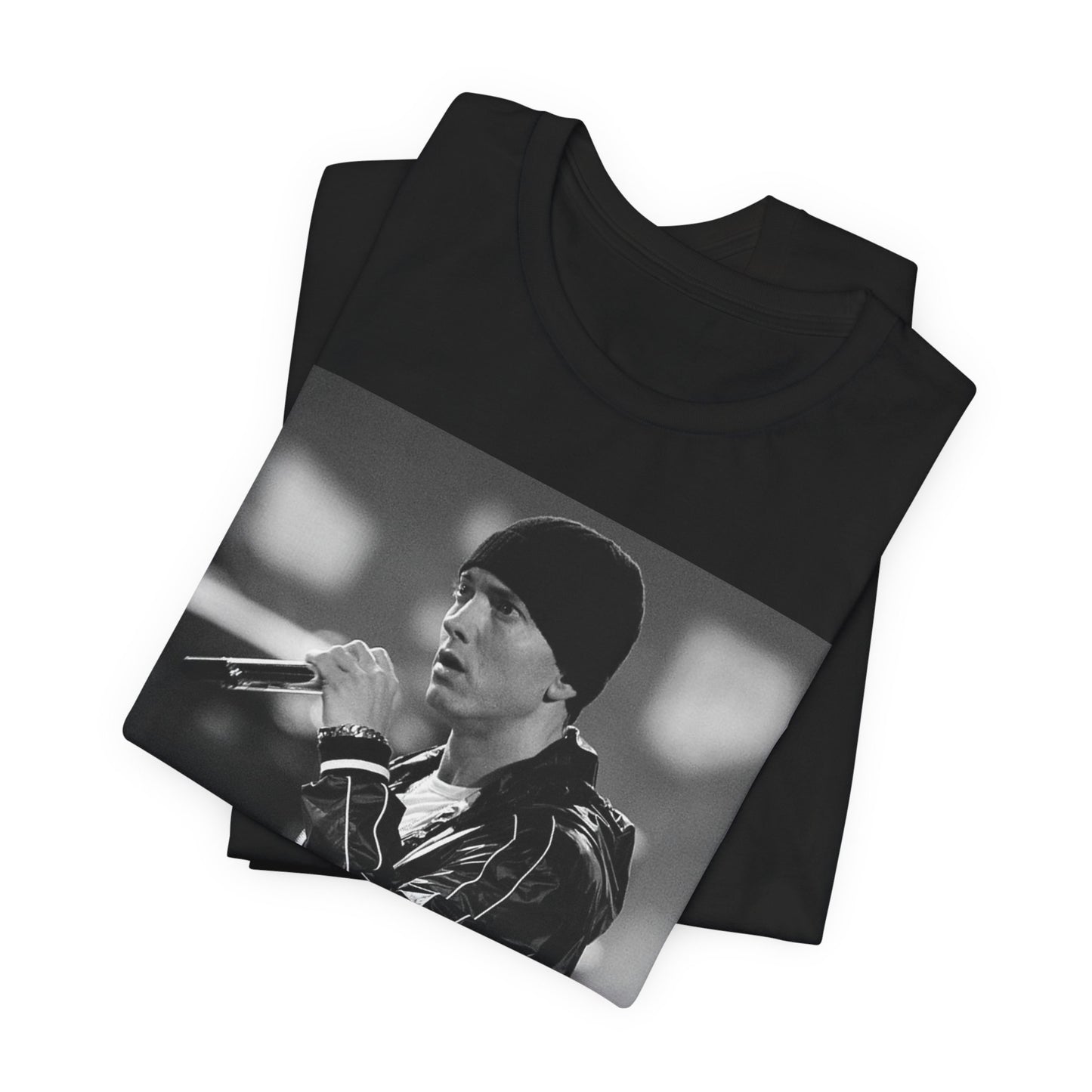 A black graphic t-shirt featuring a classic 90s graphic of Eminem as a 'Rap God'.